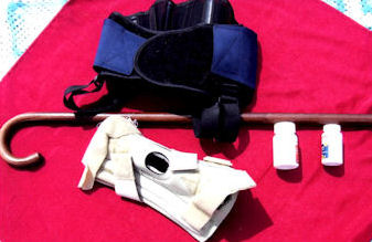 Cane, medication, and other arthritis pain relief equipment.