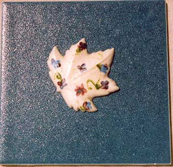 Painted leaf on 6 inch tile relief
